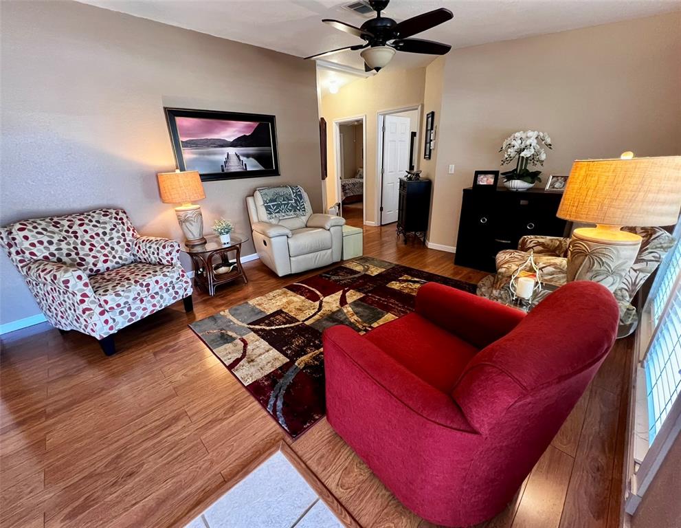 5601 Duncan Road, Unit 96 Punta Gorda, FL 33982 - Photo 4 of 30 a living room with furniture and a flat screen tv