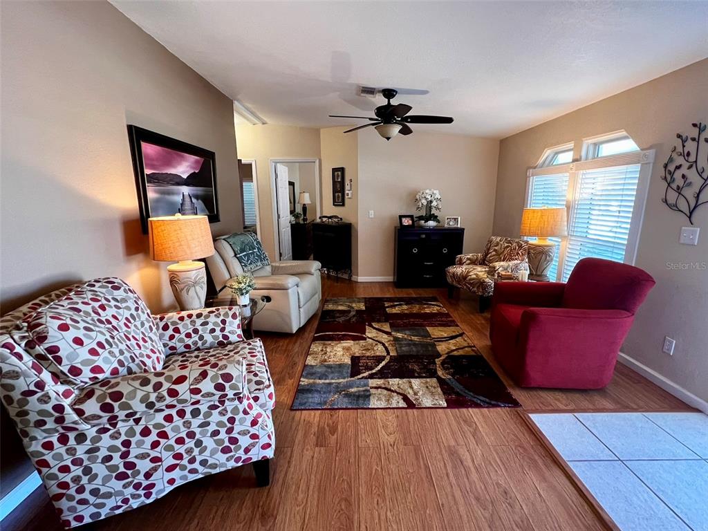 5601 Duncan Road, Unit 96 Punta Gorda, FL 33982 - Photo 5 of 30 a living room with furniture fireplace and a large window
