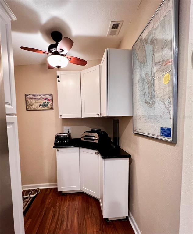5601 Duncan Road, Unit 96 Punta Gorda, FL 33982 - Photo 9 of 30 a kitchen with stainless steel appliances a white cabinet and a granite top