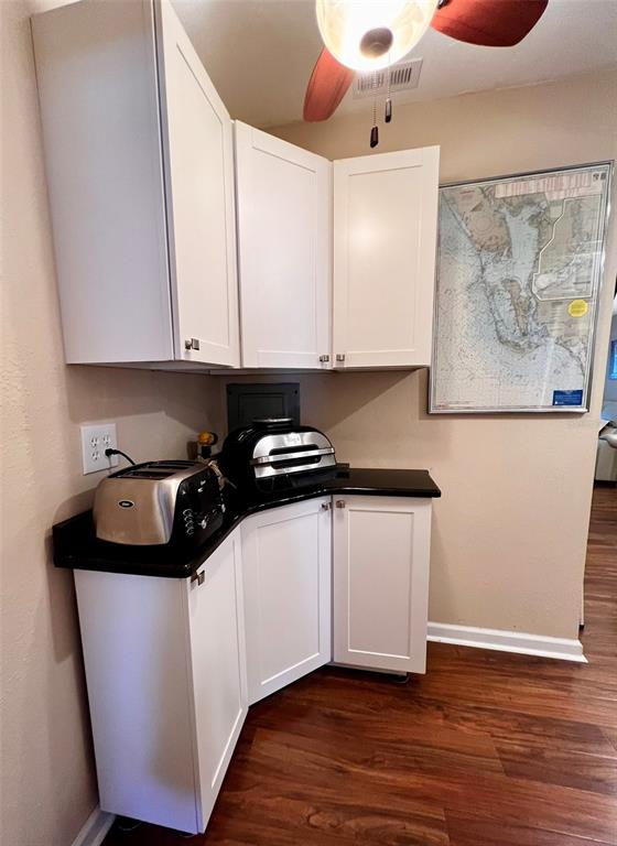 5601 Duncan Road, Unit 96 Punta Gorda, FL 33982 - Photo 10 of 30 a kitchen with white cabinets and sink