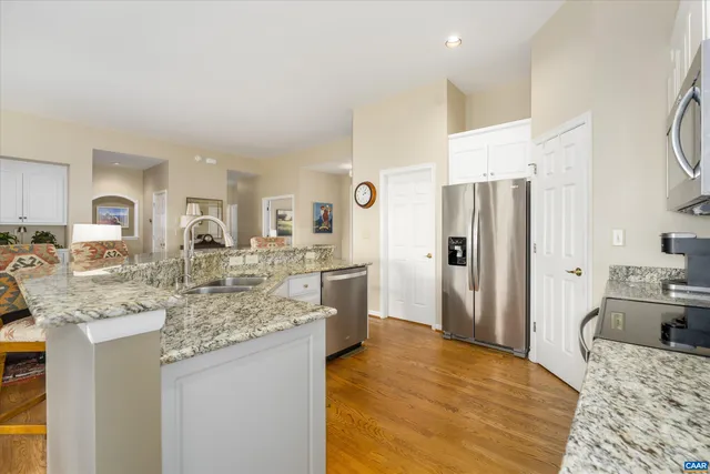 a dining room with furniture window and wooden floor