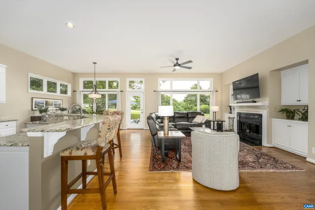 a bedroom with a bed and a large window with the outer view