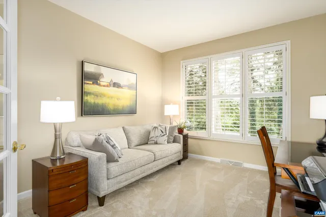 a view of livingroom with furniture and a window
