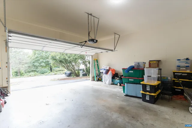 a living room filled with furniture and a potted plant
