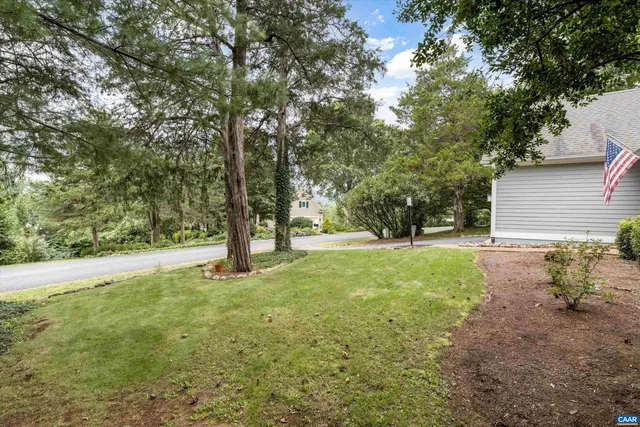 a view of a patio with chairs and a table
