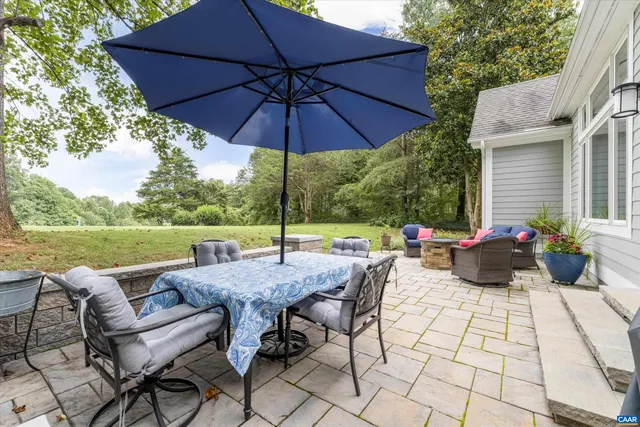 a swimming pool with trees in the background