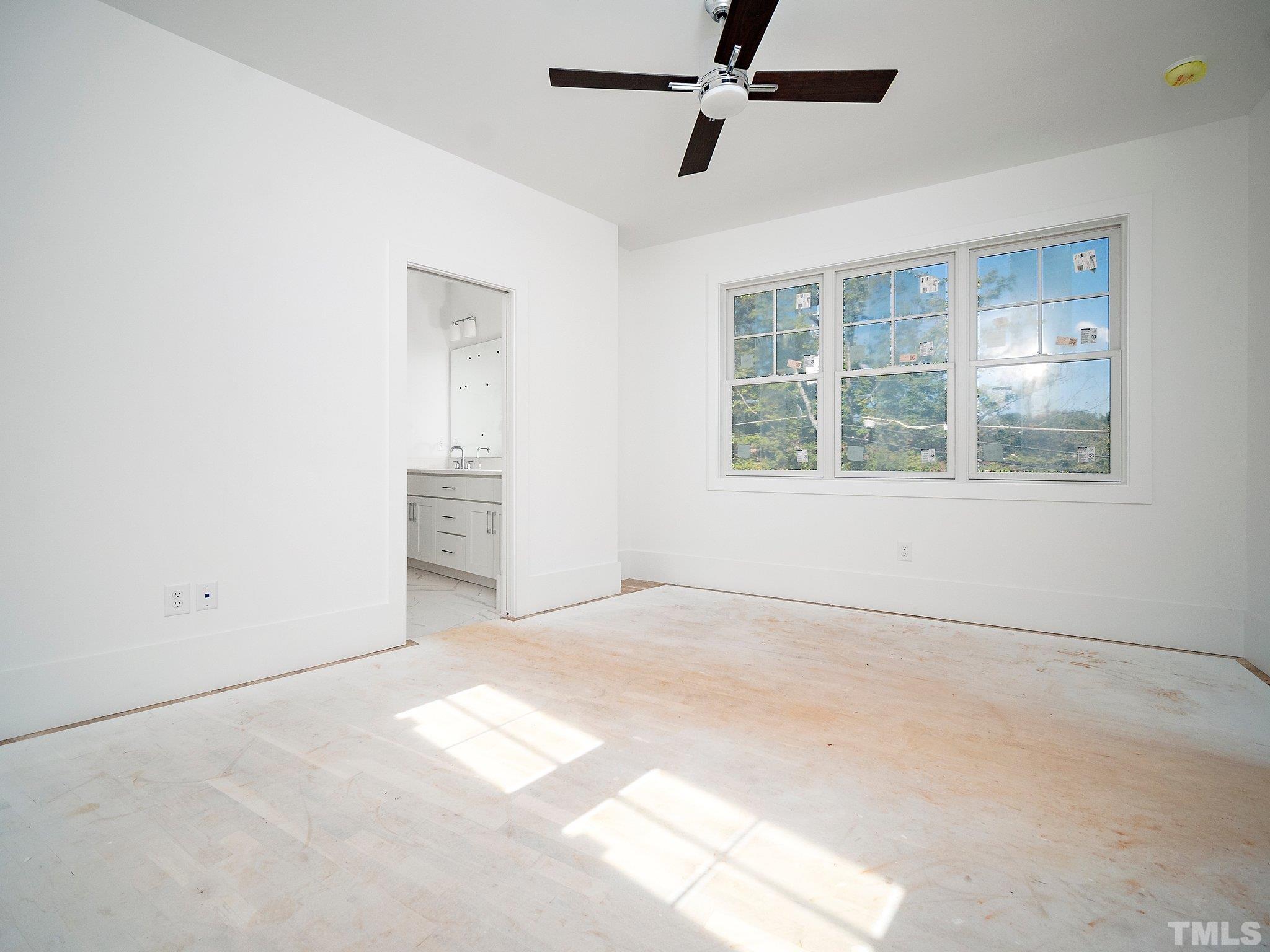 1811 Fairview Road Raleigh, NC 27608 - Photo 18 of 27 an empty room with windows and entrance