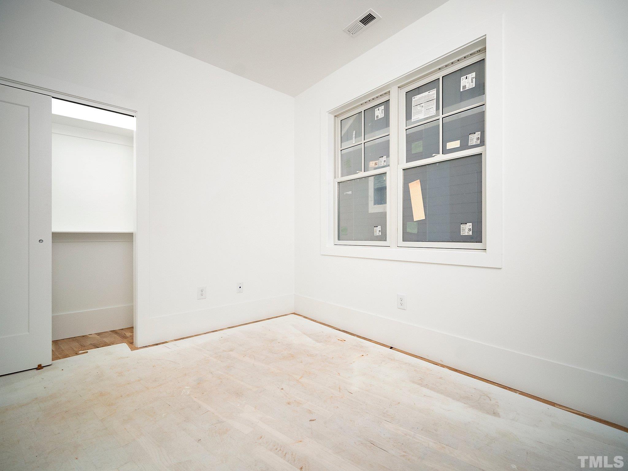 1811 Fairview Road Raleigh, NC 27608 - Photo 22 of 27 an empty room with a window
