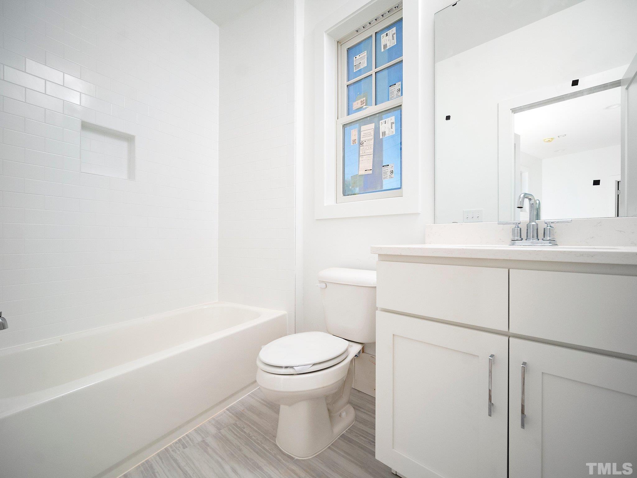 1811 Fairview Road Raleigh, NC 27608 - Photo 24 of 27 a bathroom with a sink toilet and shower