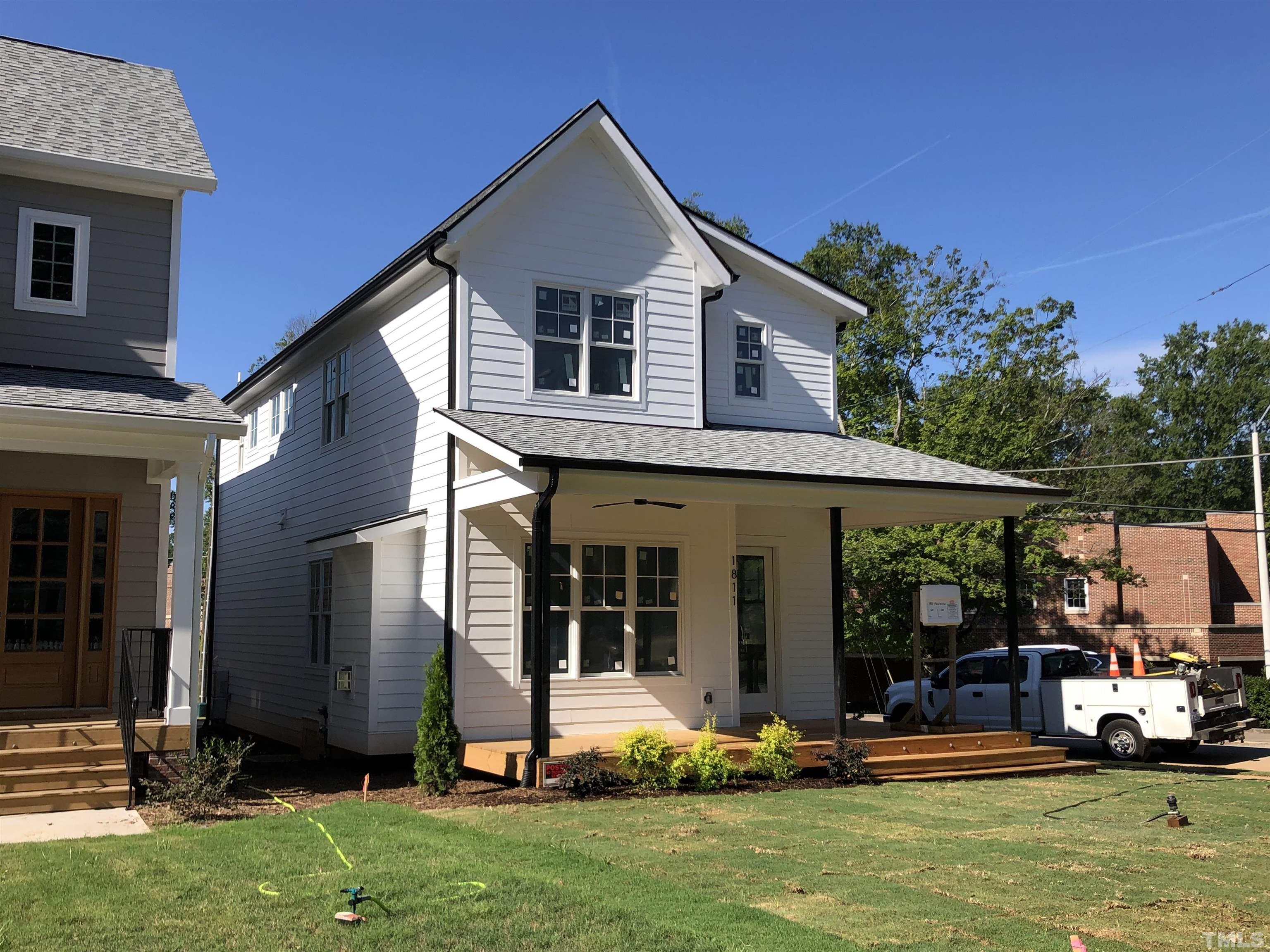 1811 Fairview Road Raleigh, NC 27608 - Photo 5 of 27 a front view of a house with a yard