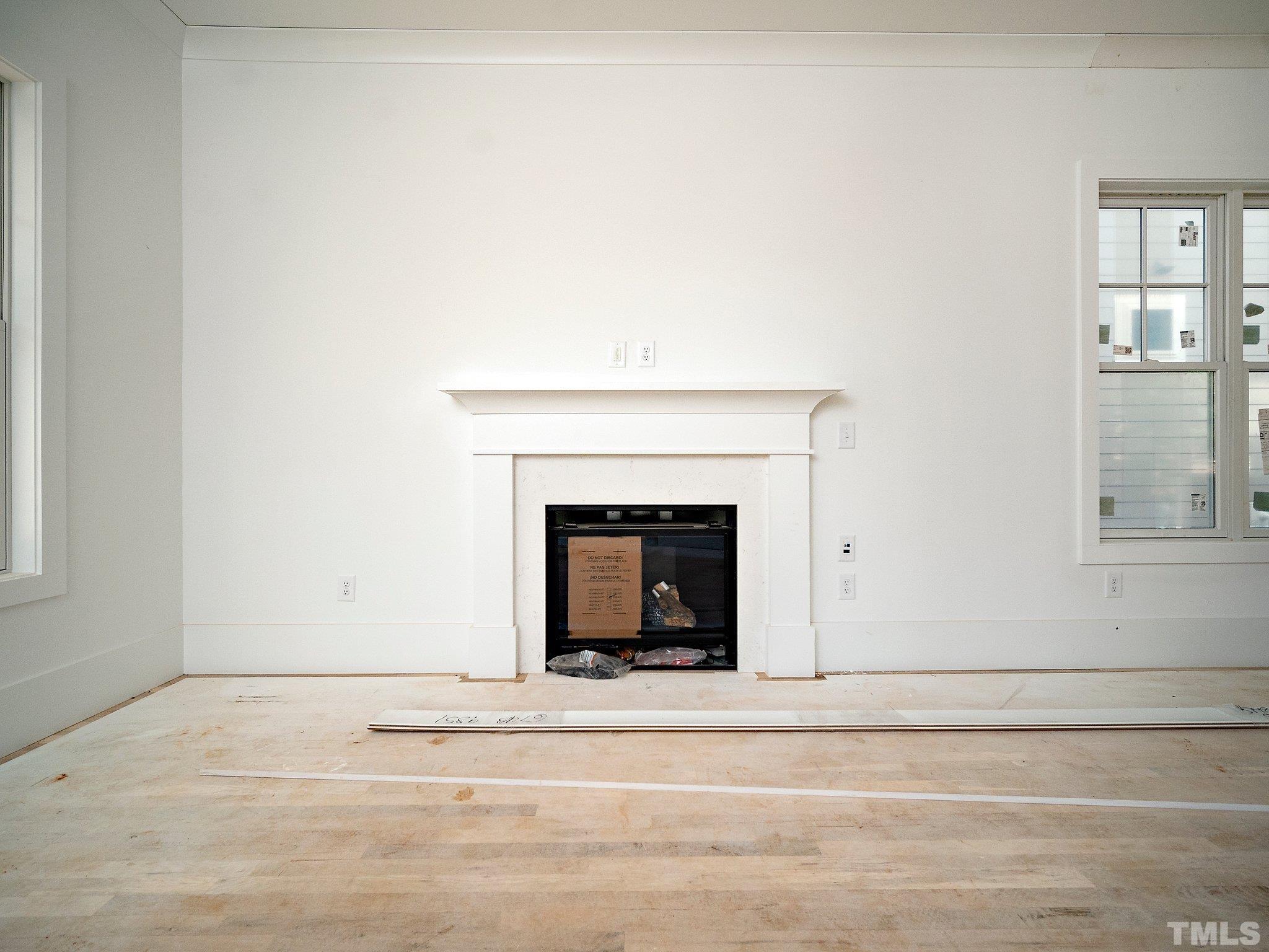 1811 Fairview Road Raleigh, NC 27608 - Photo 6 of 27 a view of a livingroom with a fireplace