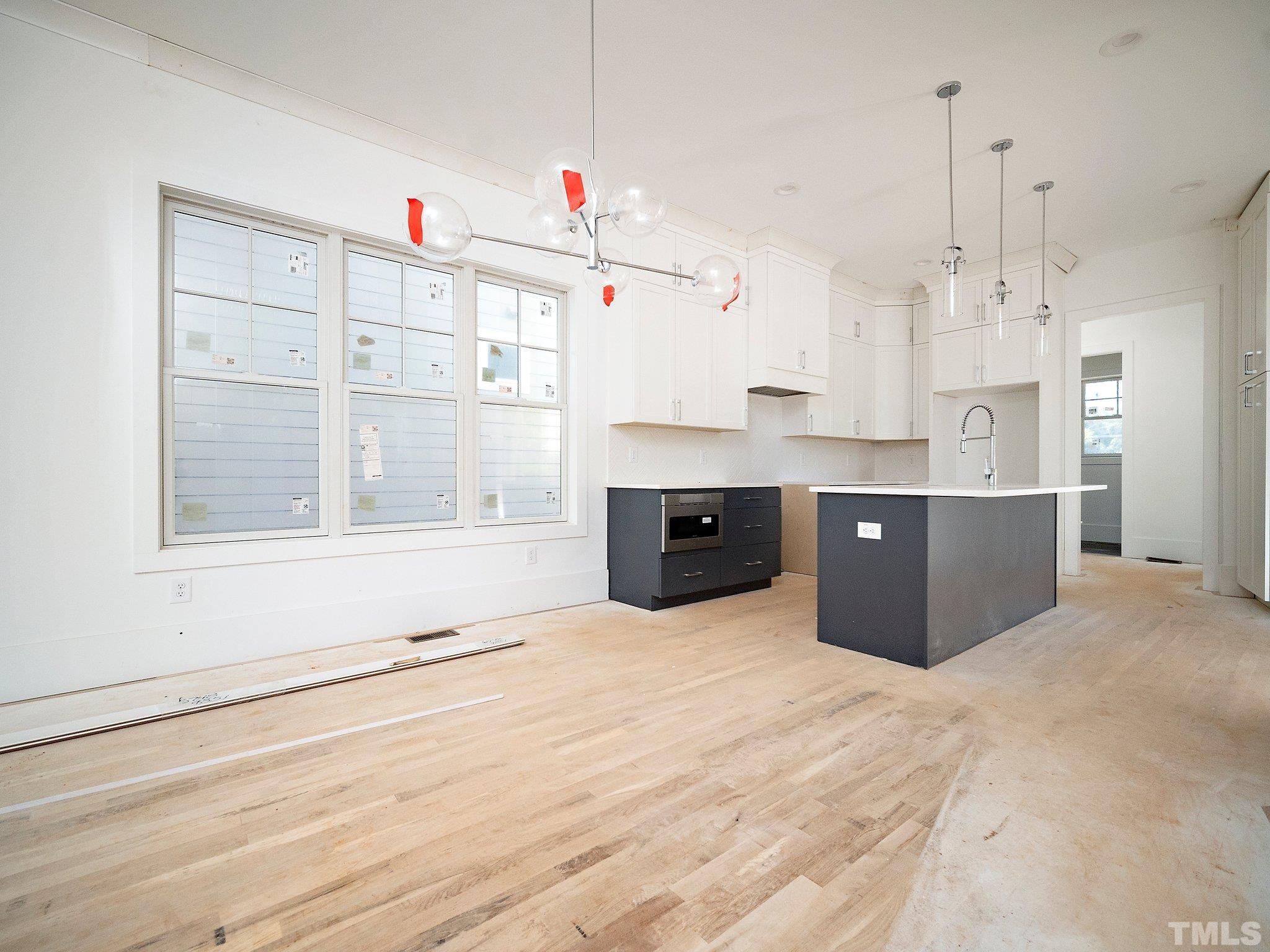 1811 Fairview Road Raleigh, NC 27608 - Photo 9 of 27 a view of kitchen with cabinets and window