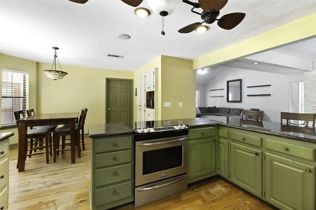a kitchen with a stove and a sink
