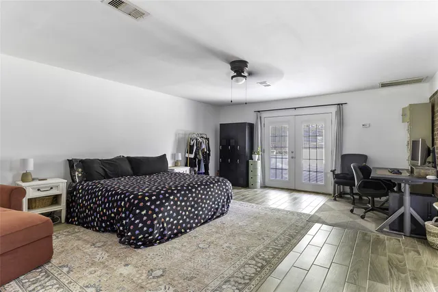 a bed room with a bed window and a desk