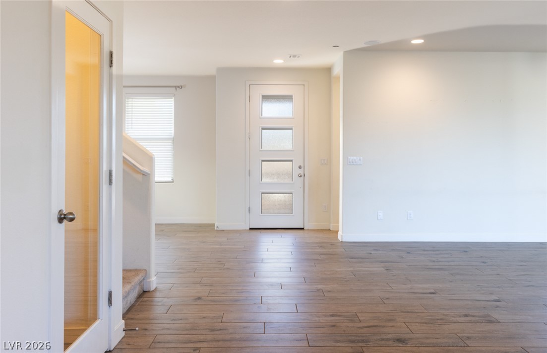 920 East Sunset Road Henderson, NV 89011 - Photo 4 of 33 A spacious entry foyer features durable wood-look flooring and abundant natural light.