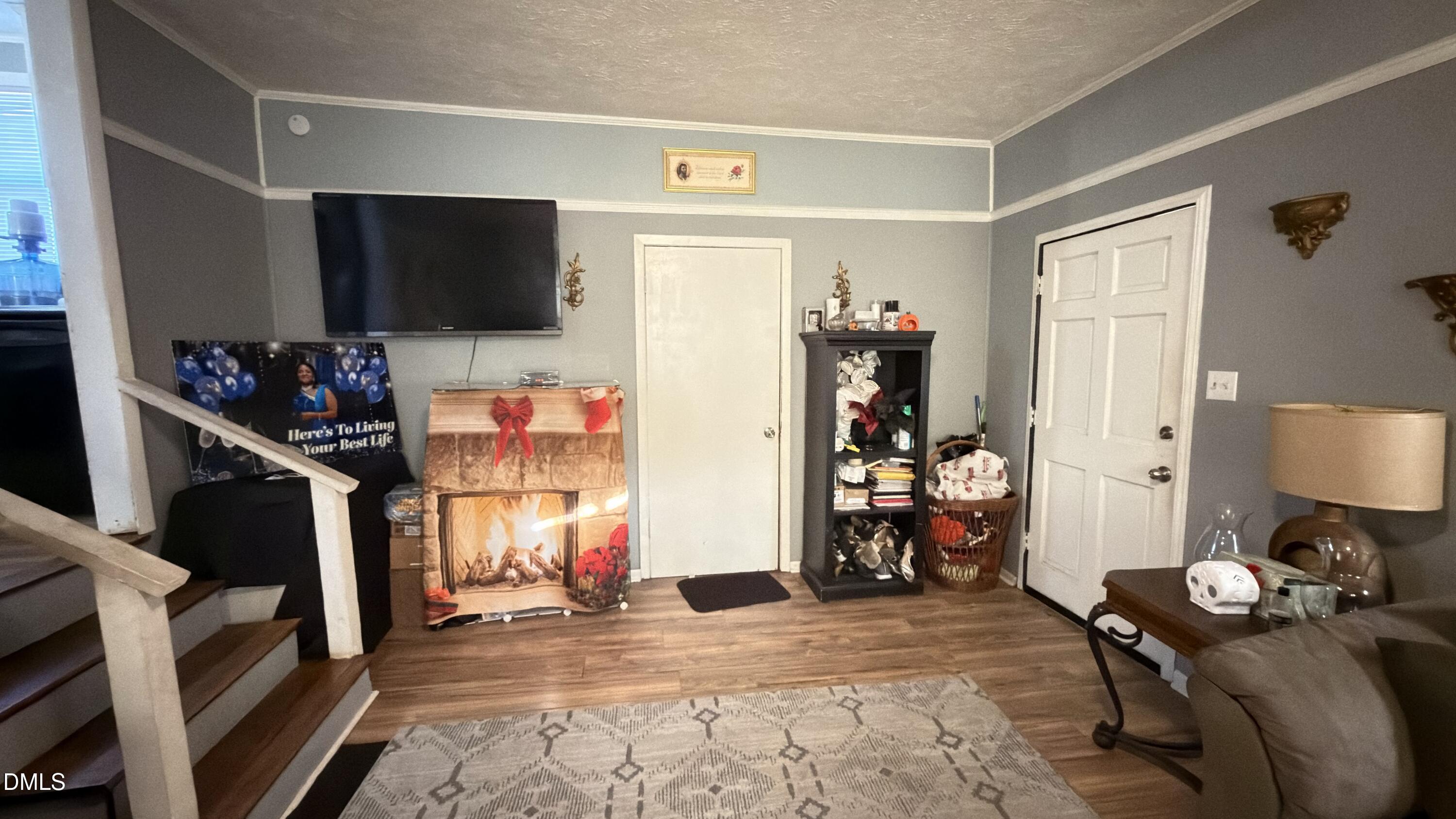 4803 Tabor Church Road Fayetteville, NC 28312 - Photo 13 of 25 a living room with furniture and a flat screen tv