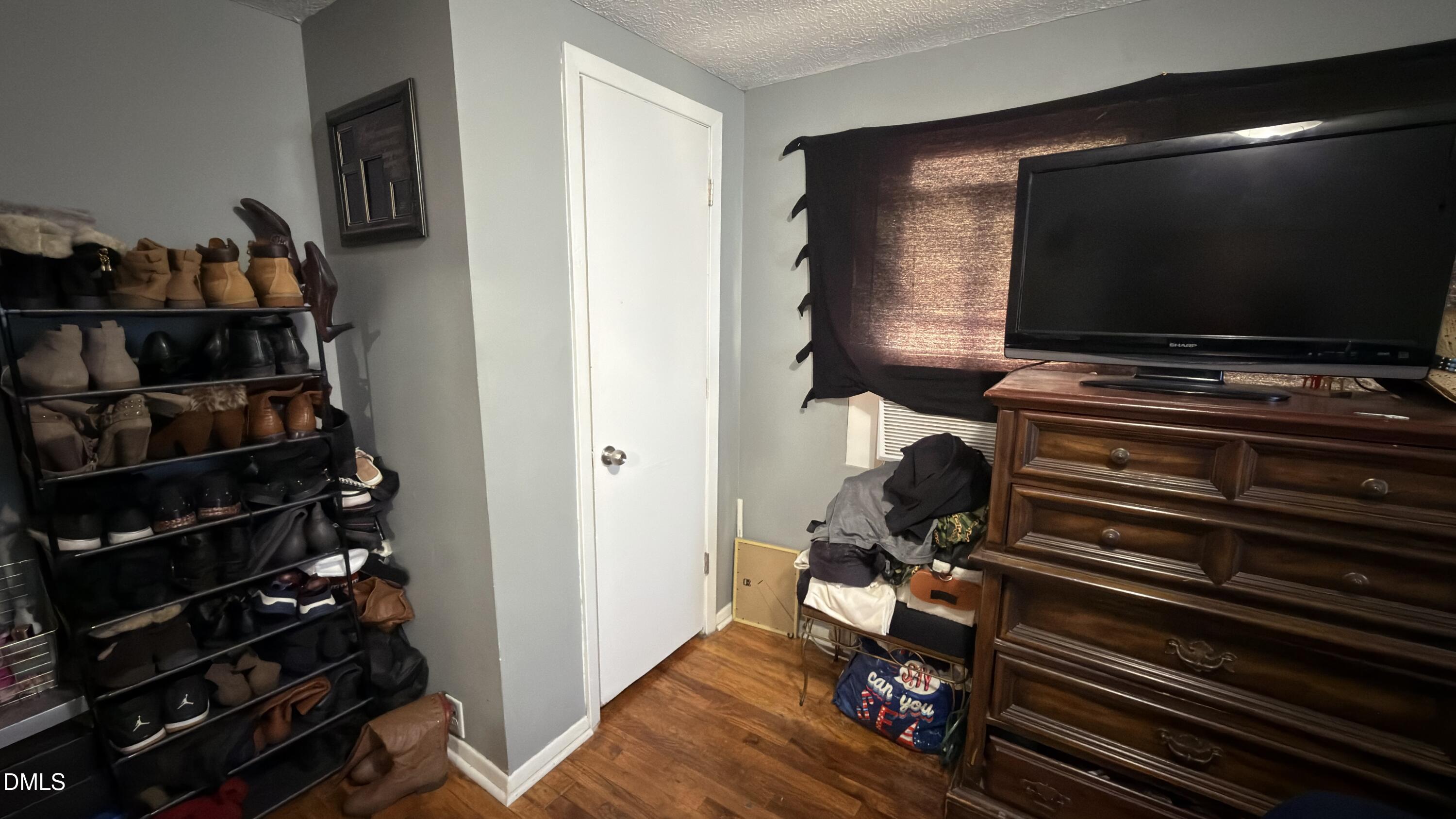 4803 Tabor Church Road Fayetteville, NC 28312 - Photo 19 of 25 a room with wooden floor and gym equipment