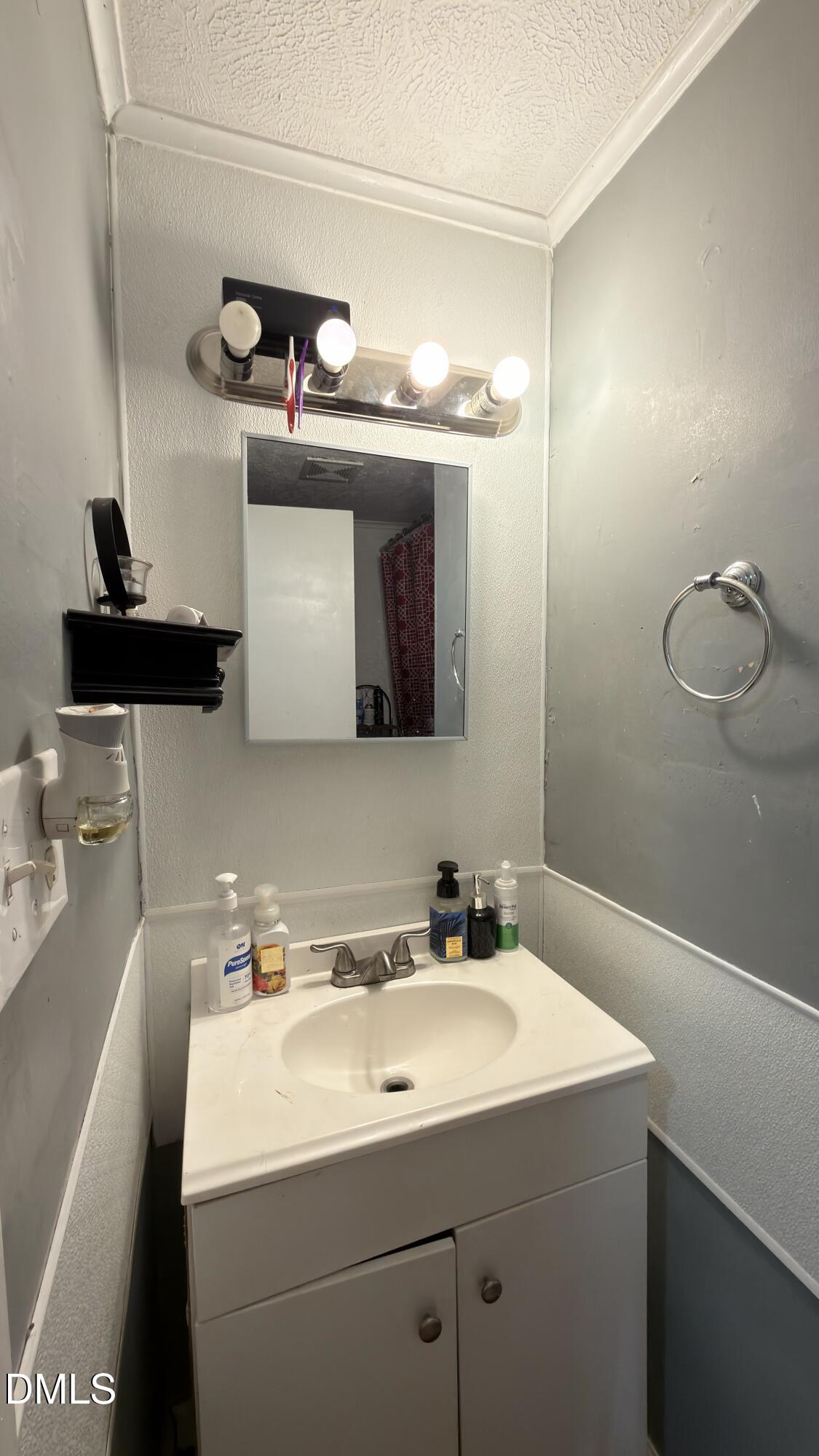 4803 Tabor Church Road Fayetteville, NC 28312 - Photo 20 of 25 a bathroom with a sink and a mirror