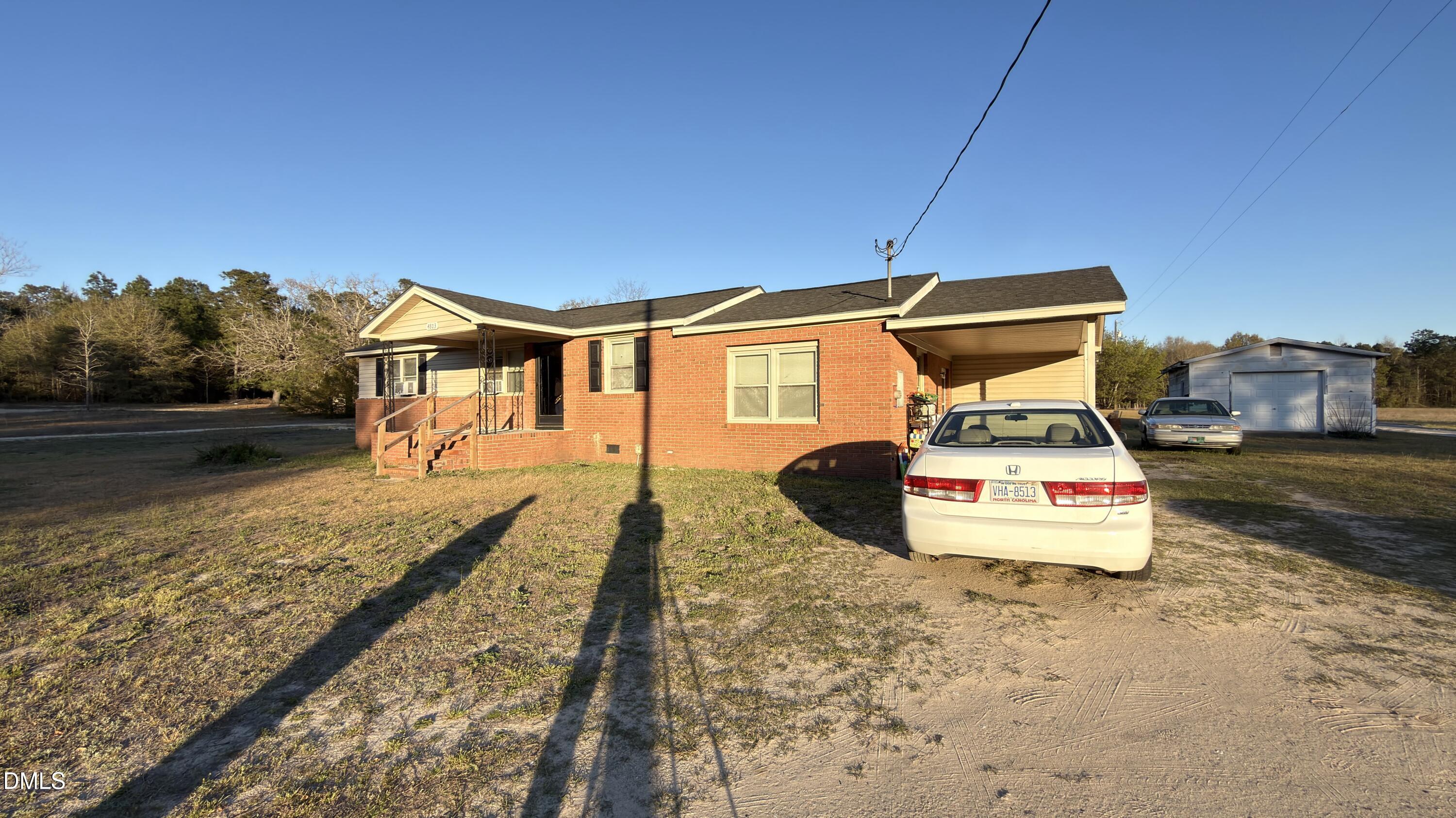 4803 Tabor Church Road Fayetteville, NC 28312 - Photo 2 of 25 a front view of a house with a yard