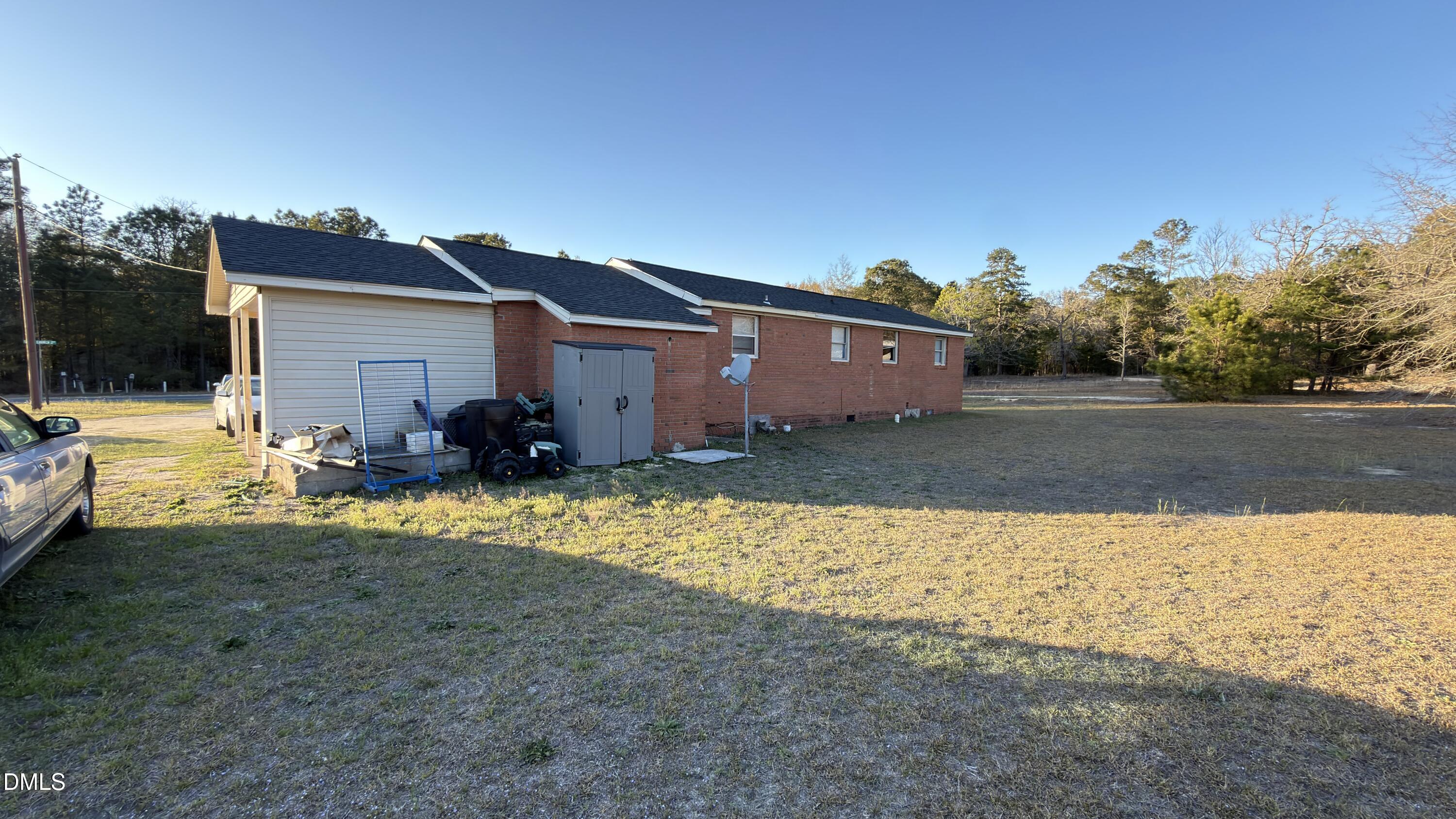 4803 Tabor Church Road Fayetteville, NC 28312 - Photo 21 of 25 a view of a house with a yard