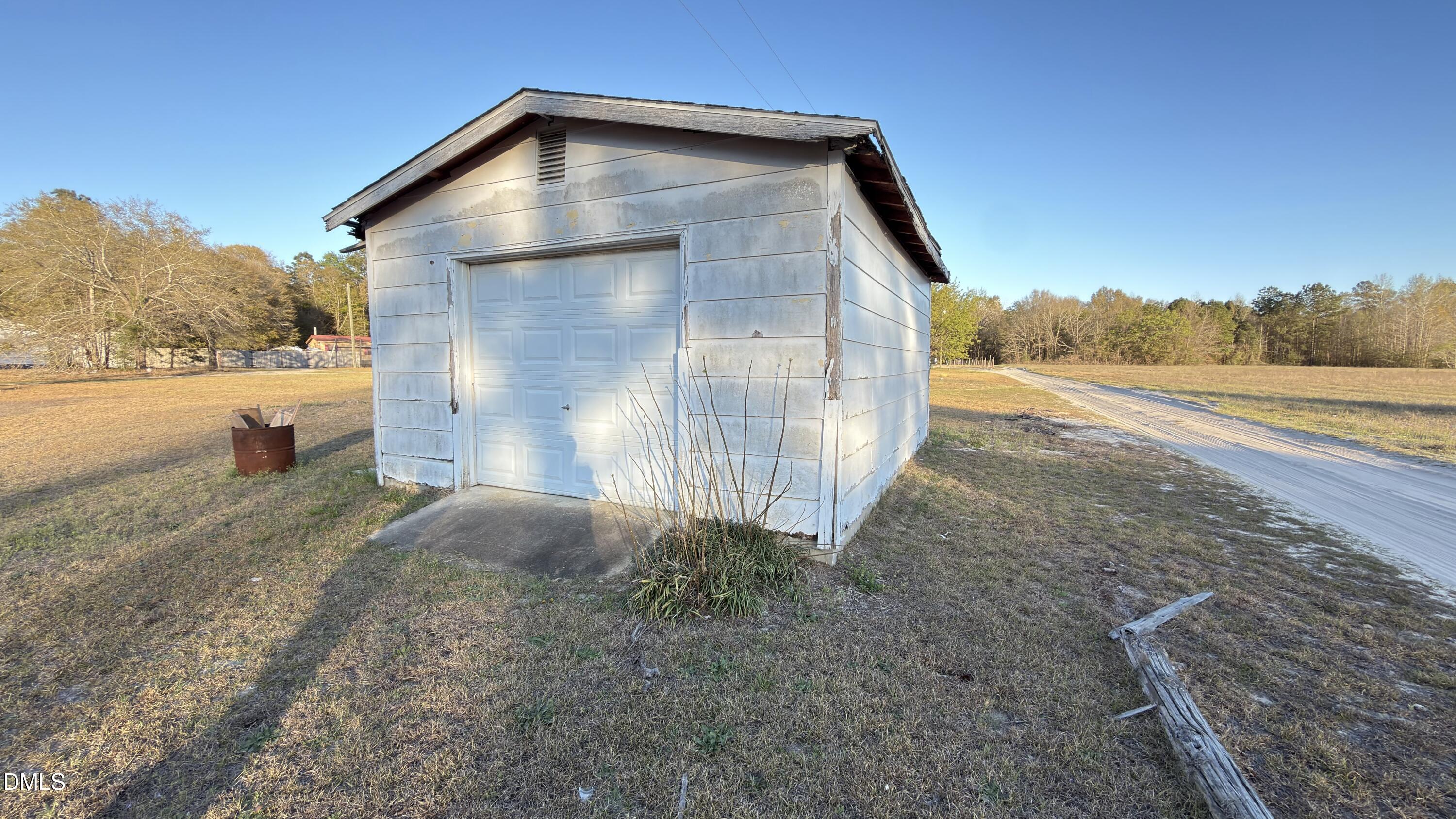 4803 Tabor Church Road Fayetteville, NC 28312 - Photo 25 of 25 a view of a house with backyard