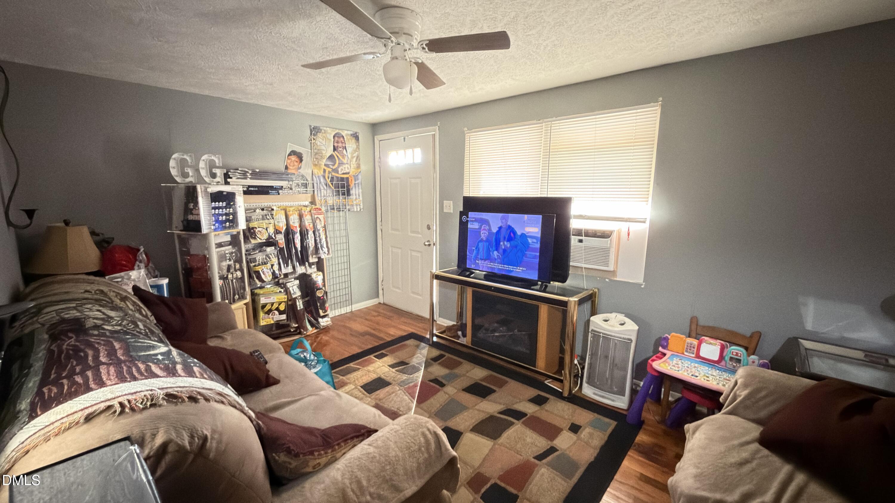 4803 Tabor Church Road Fayetteville, NC 28312 - Photo 4 of 25 a living room with furniture and a flat screen tv