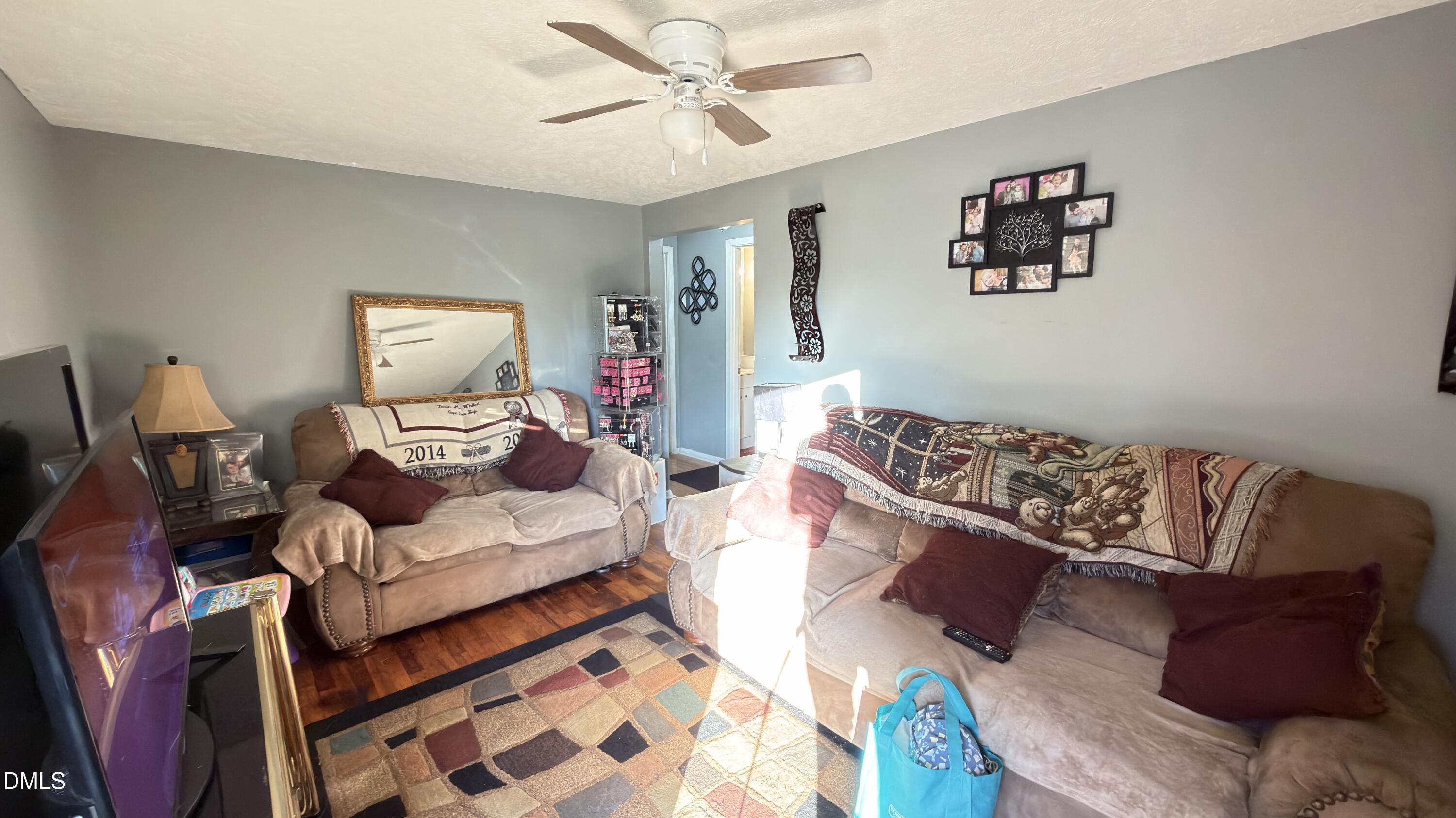 4803 Tabor Church Road Fayetteville, NC 28312 - Photo 5 of 25 a living room with furniture and a couch