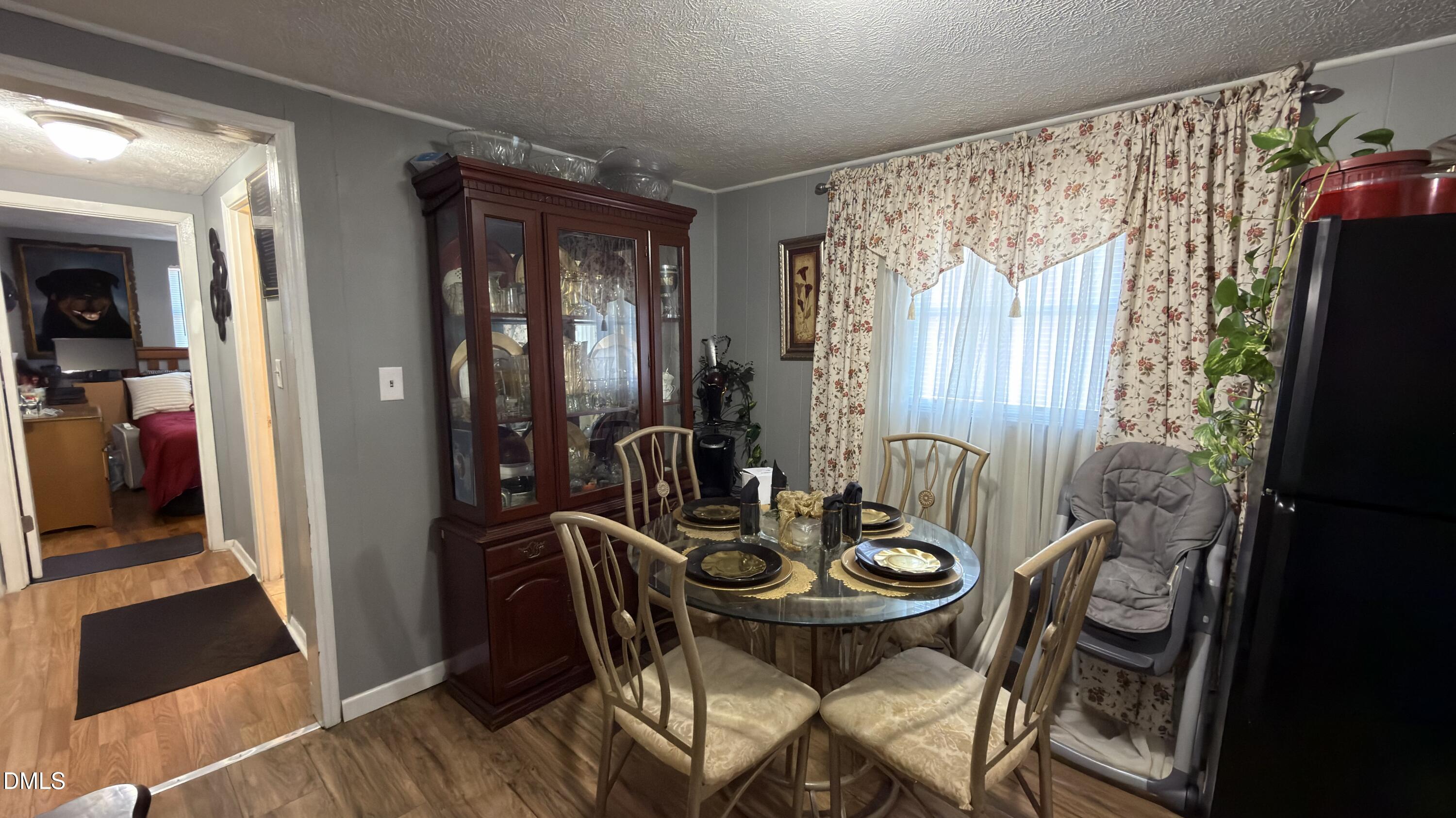 4803 Tabor Church Road Fayetteville, NC 28312 - Photo 6 of 25 a view of a dining room with furniture and chandelier