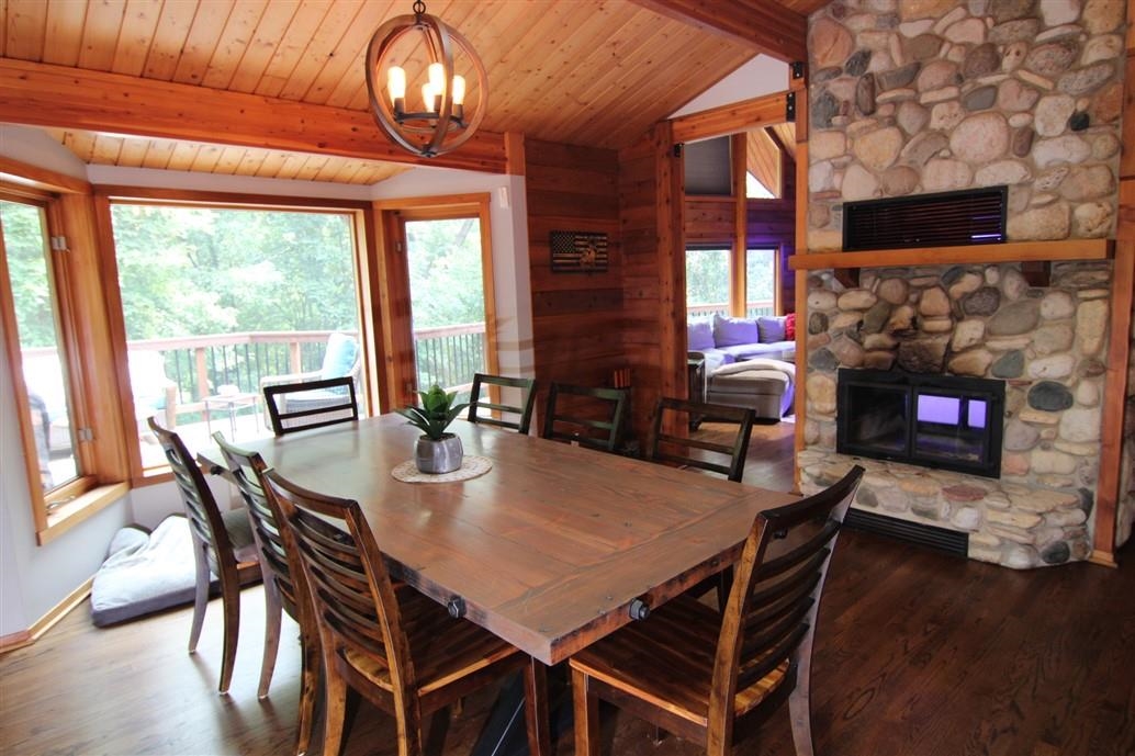 6492 Fitzgerald Road Rockford, IL 61102 - Photo 14 of 44 a view of a dining room with furniture window and wooden floor