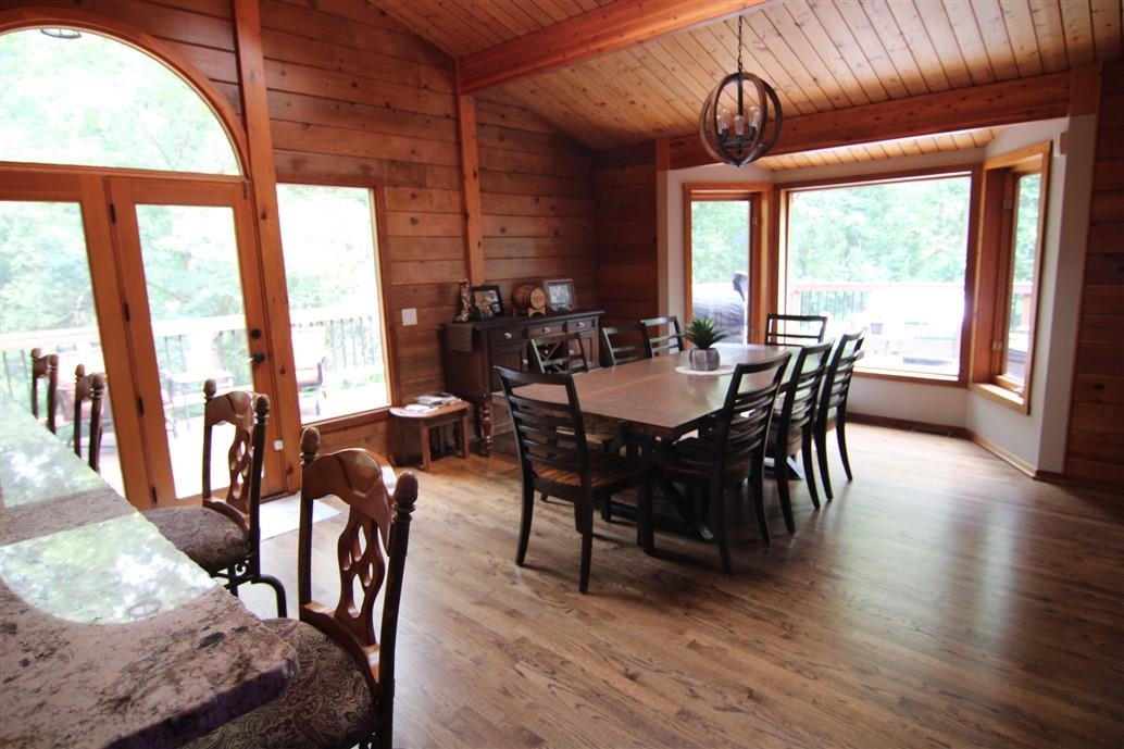 6492 Fitzgerald Road Rockford, IL 61102 - Photo 15 of 44 a view of a dining room with furniture window and wooden floor