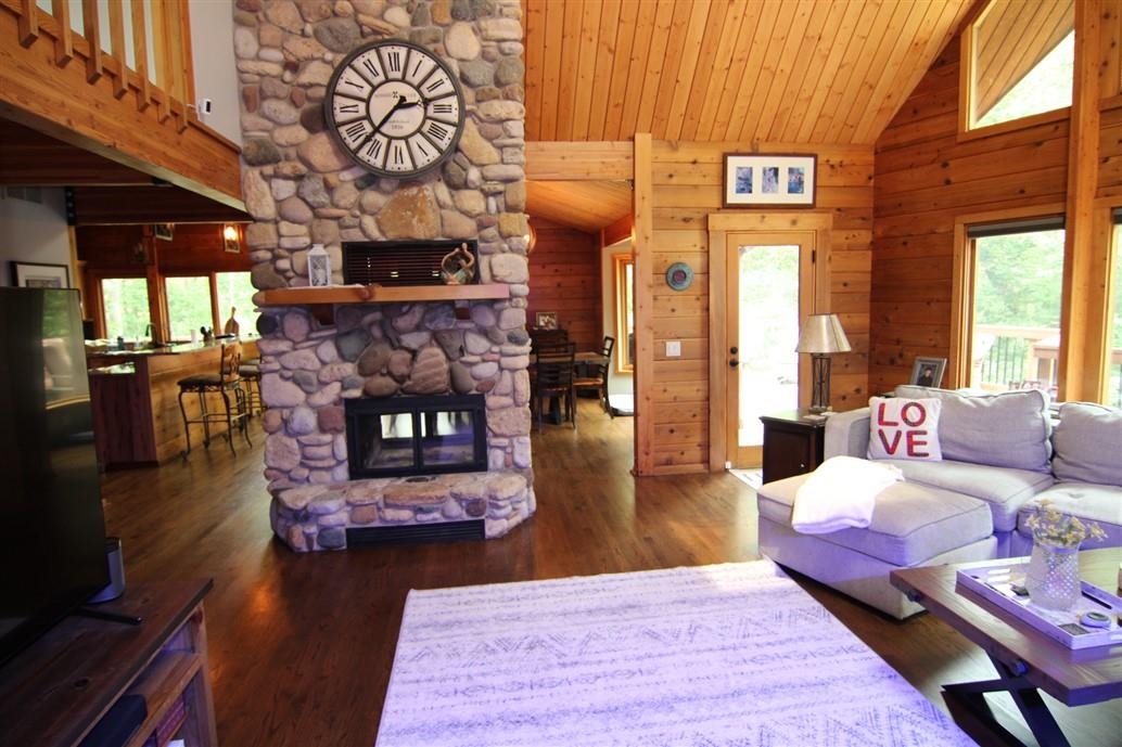 6492 Fitzgerald Road Rockford, IL 61102 - Photo 16 of 44 a living room with furniture and wooden floor