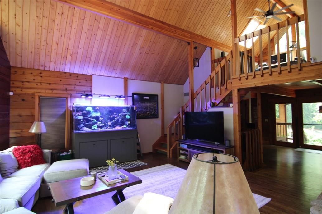 6492 Fitzgerald Road Rockford, IL 61102 - Photo 18 of 44 a living room with furniture and a flat screen tv
