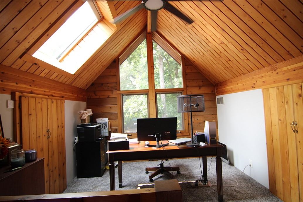 6492 Fitzgerald Road Rockford, IL 61102 - Photo 19 of 44 a view of a workspace with furniture and a window