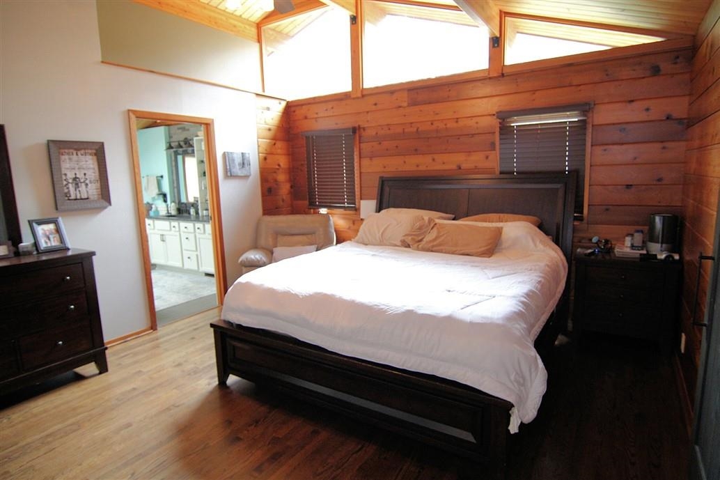 6492 Fitzgerald Road Rockford, IL 61102 - Photo 20 of 44 a bedroom with a bed and wooden floor