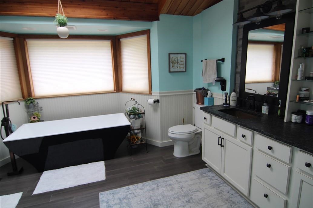 6492 Fitzgerald Road Rockford, IL 61102 - Photo 21 of 44 a bathroom with a sink mirror vanity and toilet