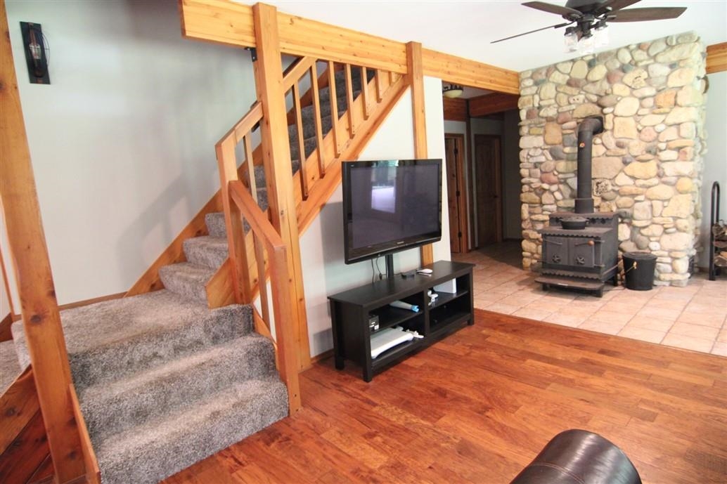 6492 Fitzgerald Road Rockford, IL 61102 - Photo 27 of 44 a view of staircase with furniture and a window