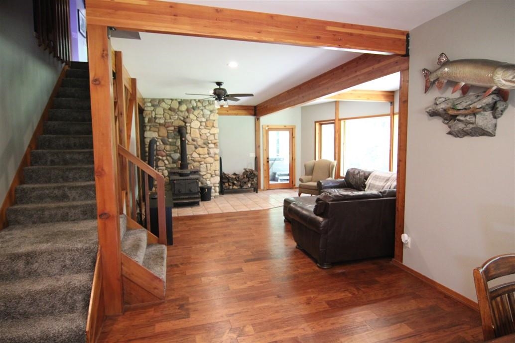 6492 Fitzgerald Road Rockford, IL 61102 - Photo 28 of 44 a living room with furniture and a fireplace