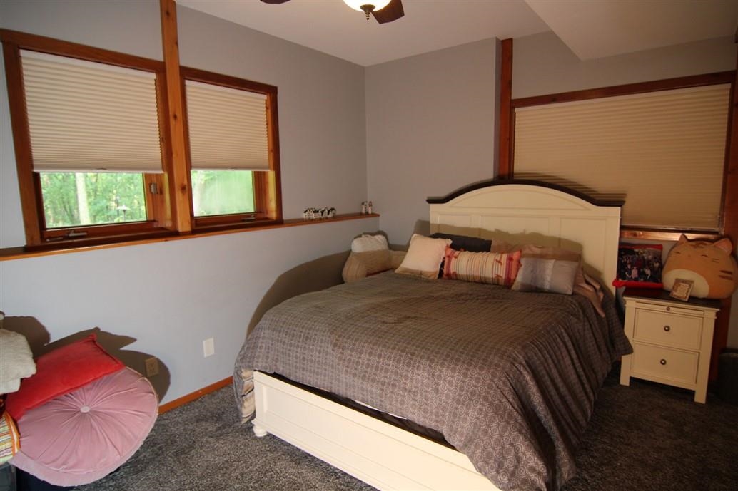 6492 Fitzgerald Road Rockford, IL 61102 - Photo 31 of 44 a bedroom with a bed and window