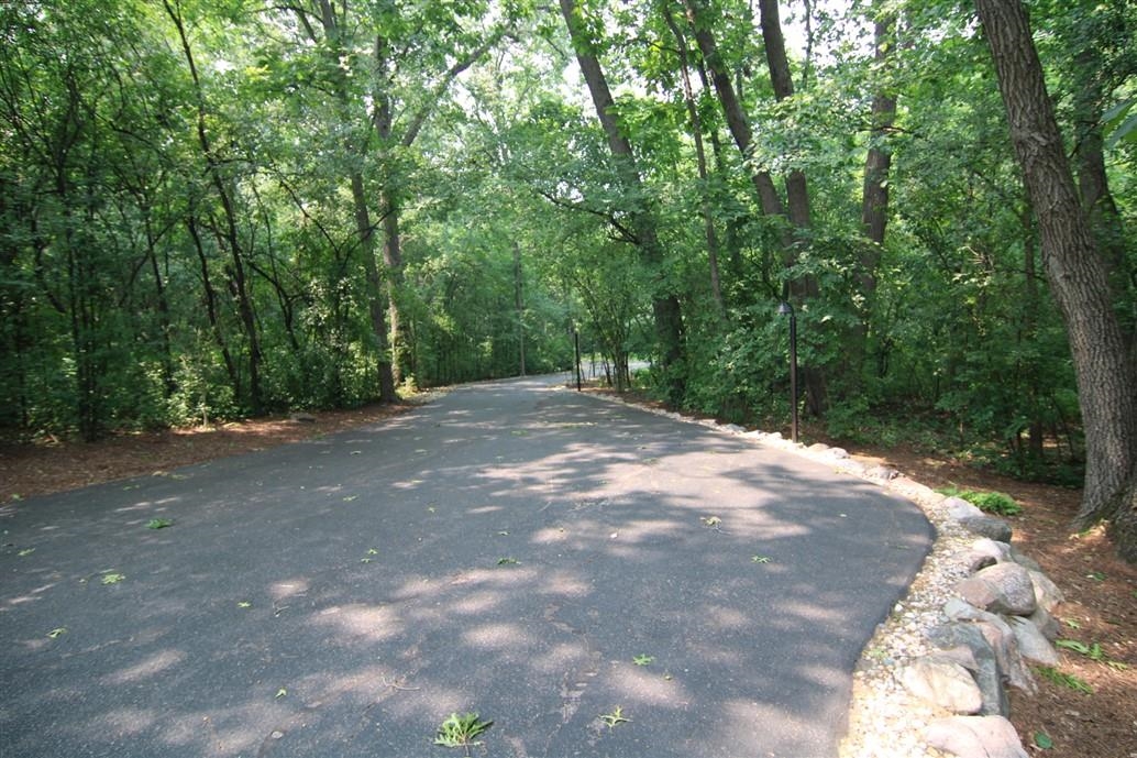 6492 Fitzgerald Road Rockford, IL 61102 - Photo 44 of 44 a view of a yard with plants and trees