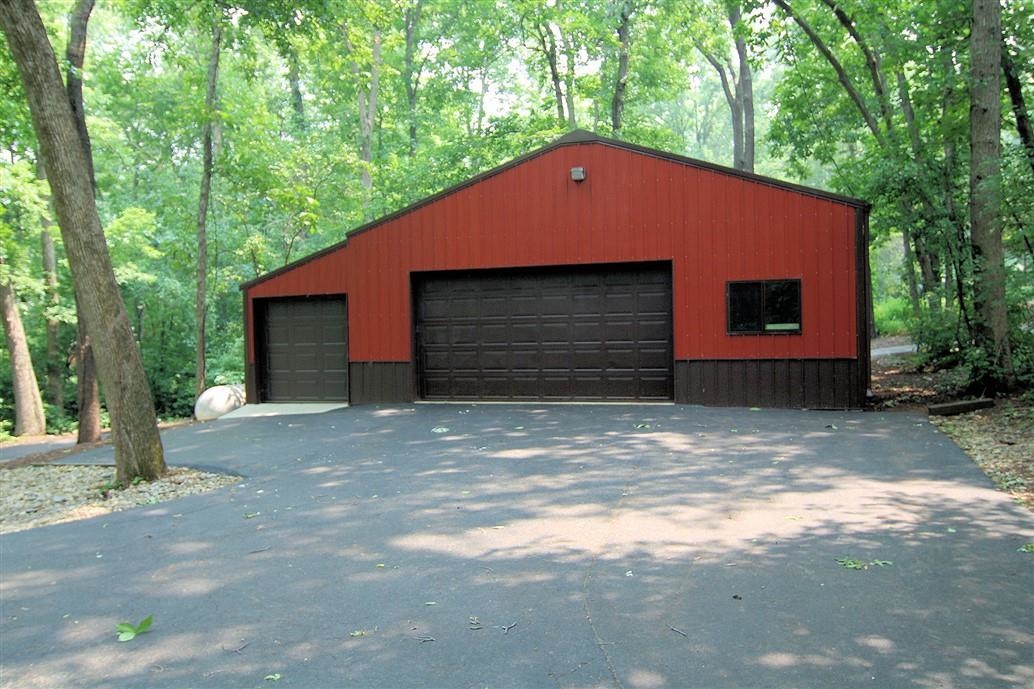 6492 Fitzgerald Road Rockford, IL 61102 - Photo 9 of 44 a front view of a house with a yard