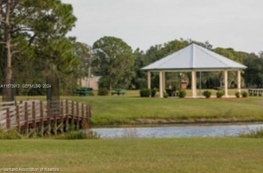 4926 Maya Street Sebring, FL 33872 - Photo 12 of 29 a front view of a house with a yard