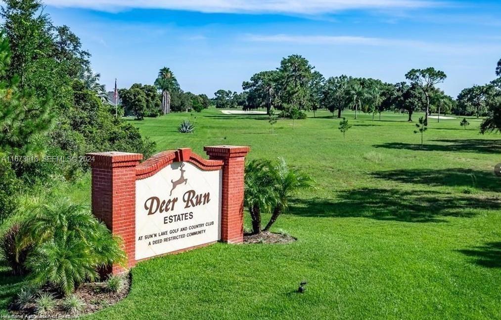 4926 Maya Street Sebring, FL 33872 - Photo 5 of 29 a sign that is sitting in the grass near a building