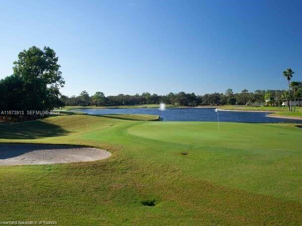 4926 Maya Street Sebring, FL 33872 - Photo 6 of 29 a view of a lake with houses in the background