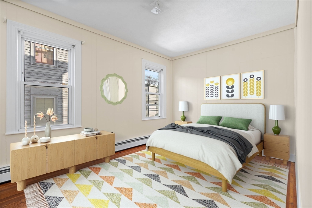 a spacious bedroom with a bed and a large mirror