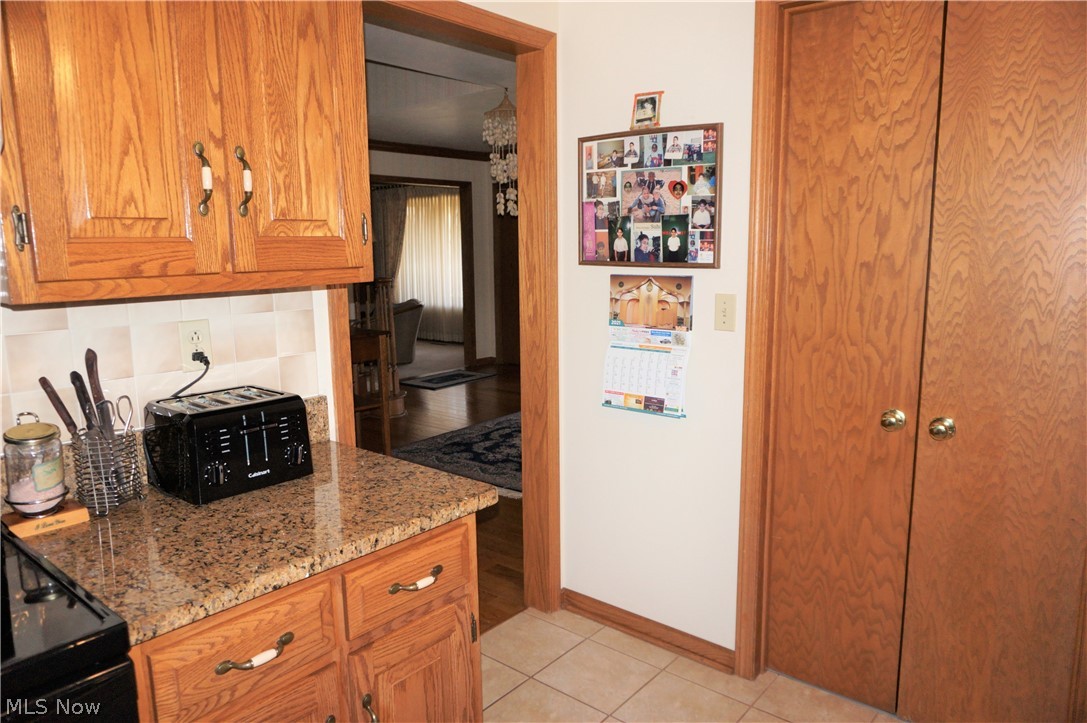 2577 Sourek Road Akron, OH 44333 - Photo 14 of 35 So much storage. This view of kitchen. Door leads to formal dining room.