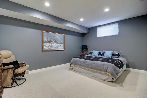 a bedroom with bed and a window