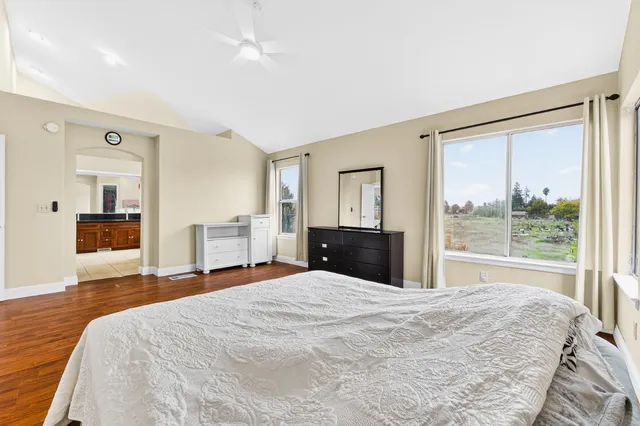 a large bathroom with a glass door shower and sink