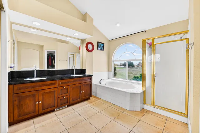 a view of a bathroom with tub and door