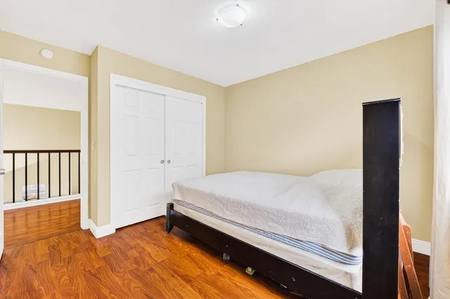 a bedroom with furniture window and wooden floor