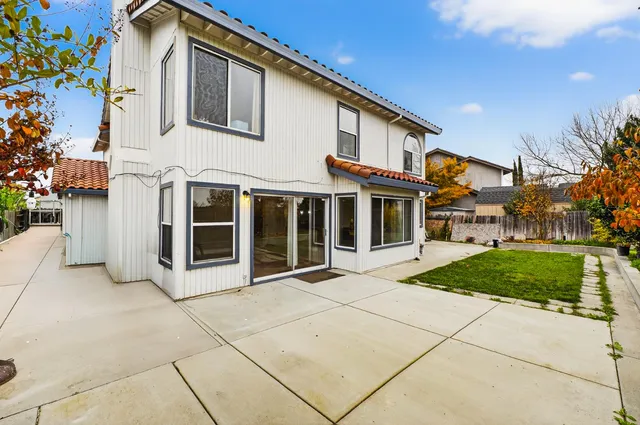 a view of a patio with a yard